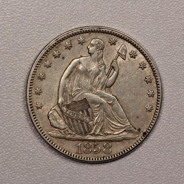 1858 Seated Liberty Half Dollar AU-50 | Of Coins & Crystals