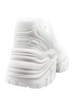 Rear view of the white BLAIR platform sneakers, highlighting the high-profile rubber platform heel and minimalist stitched seams.