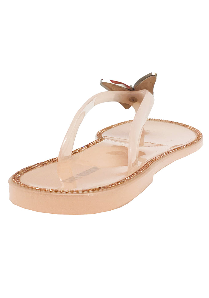 Top-down studio profile of the blush pink jelly sandals, showcasing the contoured footbed and durable rubber traction pattern.
