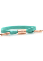Rastaclat Brandy Women's Single Lace Bracelet in turquoise rose gold with single shoelace cord and rose gold hardware on festival bracelet — front view