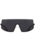 Komono CRAFTED Sonny Midnight Sunglasses in black with chic curved frame and matte black metal trim on festival sunglasses — front view