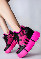 On-foot styling view of Anthony Wang CRANBERRY 08 Pink Circuit platform sneakers showcasing the vibrant pink structural hardware plates, patterned laces, and high-top ankle fit