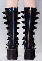 Demonia DAMNED 318 Delusional Dream Hologram Black Platform Boots in iridescent holographic vegan leather with back zip closure worn by model — back view