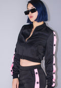 Hot & Delicious Deal With It Tracksuit Crop Jacket in black pink with contrast stripe and button detail on rave jacket — model view