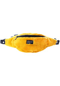 HXTN Supply Furocious One Belt Bag in mustard yellow with faux fur outer and branded label on festival rave belt bag — front view