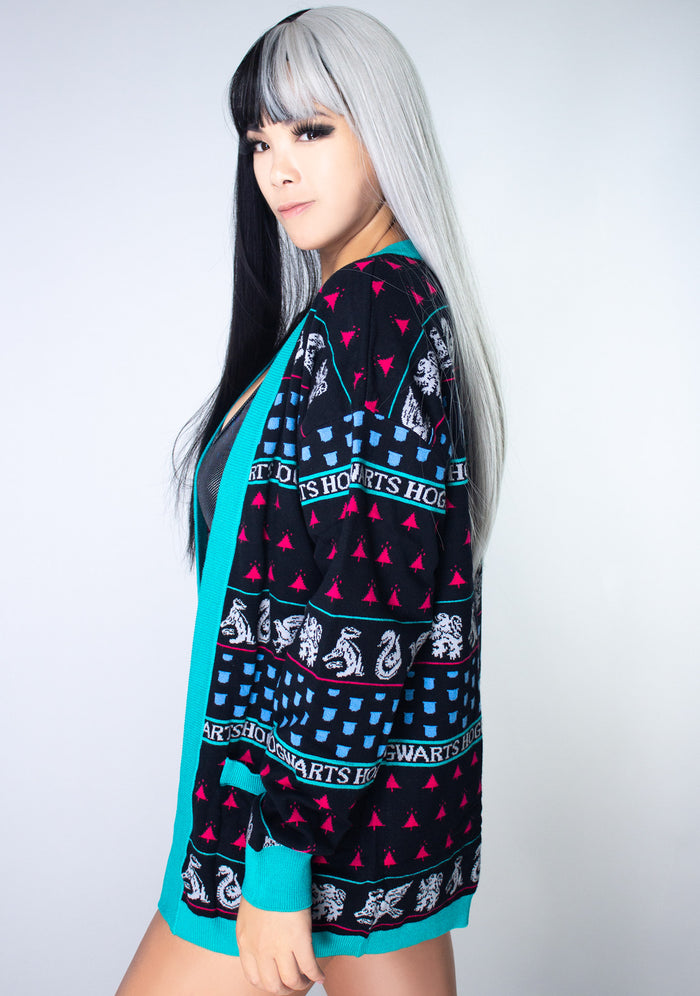 Bioworld Harry Potter Hogwarts House Holiday Cardigan in black multi with jacquard knit house-themed pattern on fandom rave festival jacket — model side view