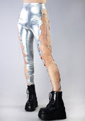 Hot & Delicious Intergalactic Metallic Lace Up Leggings in silver with cut-out lace-up side detail on rave bottoms — model view