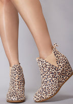 TOMS Kelsey Suede Boot in leopard with all-over leopard print on suede wedge heel festival ankle boot — model front view