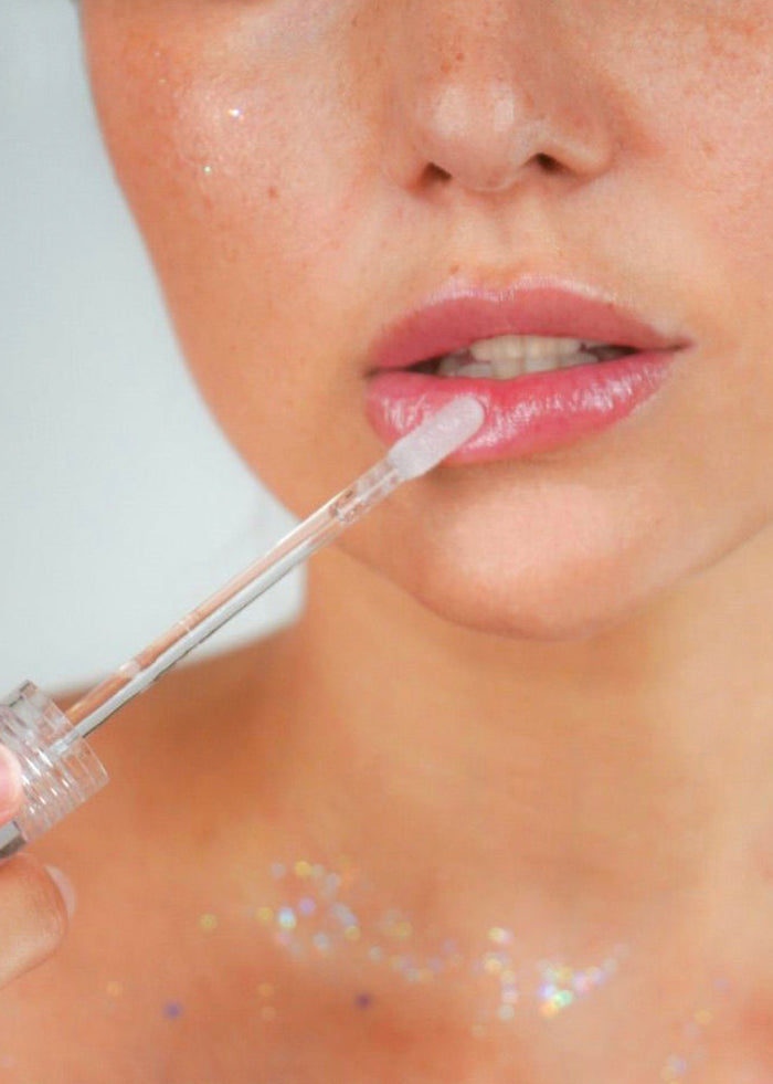 Lavender Stardust Lilac Sparkle Cosmic Lip Gloss in light purple — detail view