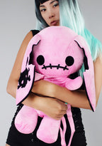 Sleepyville Critters Naughty Bunny Pink Plush Backpack in pink with 3D bunny plush design and skull patch ear accent on kawaii goth rave backpack — model front view