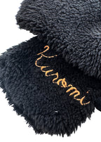 Sanrio Kuromi Plush Muffler Scarf in black with Kuromi plush face on knit muffler rave winter accessory — texture detail view