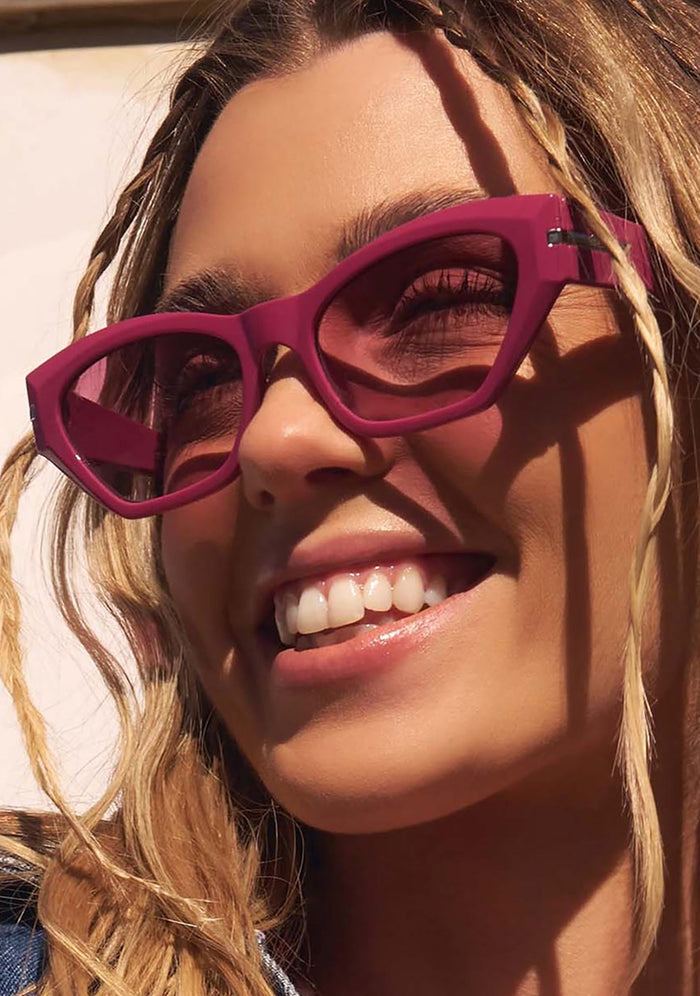 Dime Optics Sawtelle Polarized Sunglasses in glossy berry garnet gradient — model view