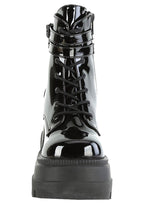 Demonia SHAKER 52 Paint it Black Patent Black Platform Boots in black patent leather showing 4.5 inch stacked wedge platform height and traction sole — side view