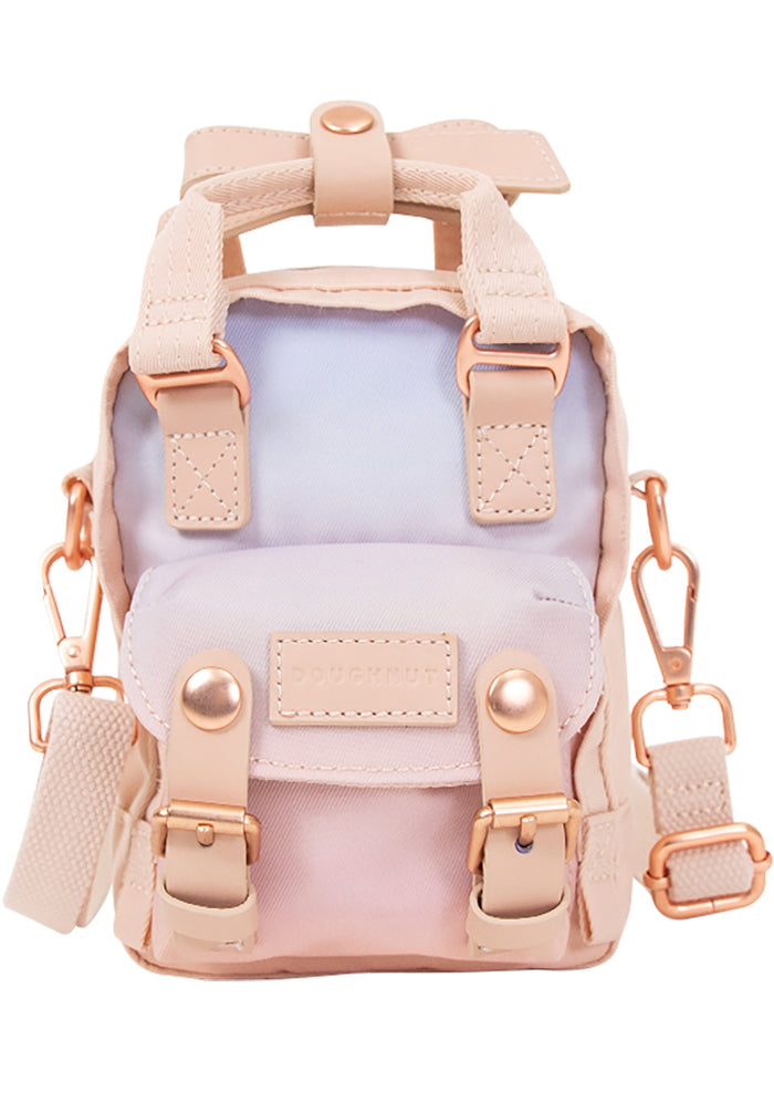 Doughnut Official Sky x Ribbon Series Macaroon Tiny Crossbody Bag in soft sunrise pink ombre with rose gold hardware and leather trim on festival crossbody bag — front view