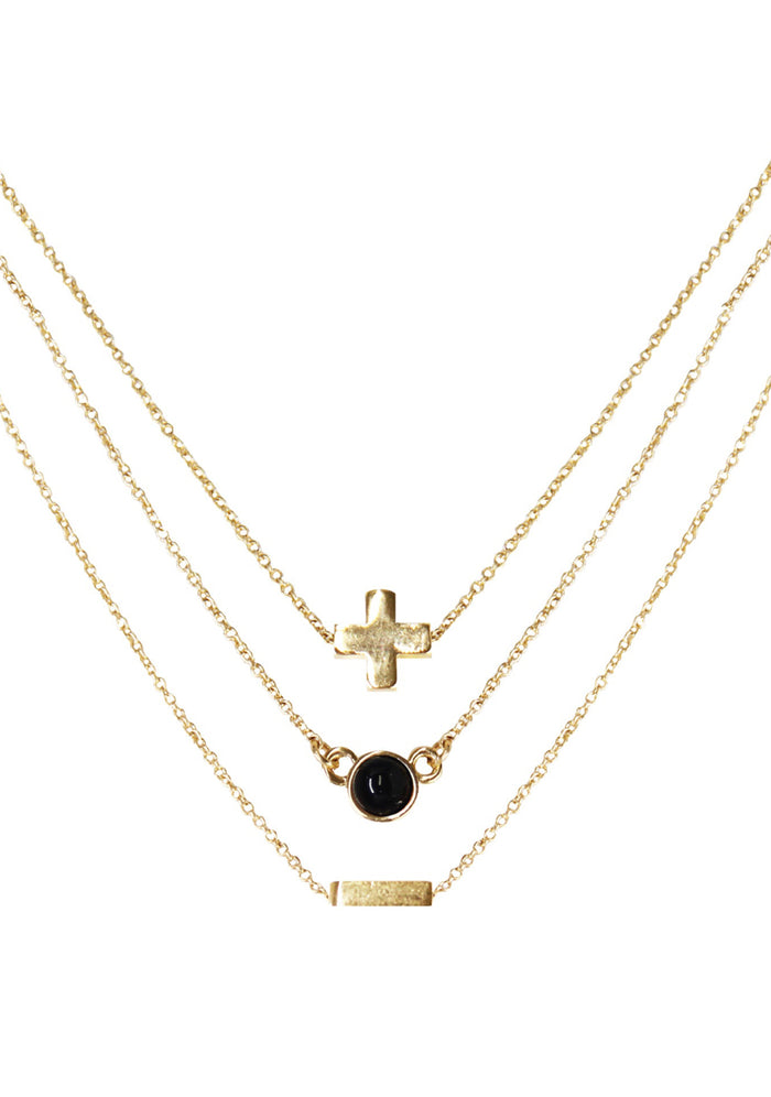 Charged Strength Onyx Delicate Chain Necklace Set in gold with raw black onyx stone on three 18k gold plated chain crystal festival necklace set — front view