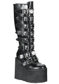 Demonia SWING 815 Beautiful Destruction Black Platform Boots in black vegan PU leather with silver metal plate hardware and 5.5 inch wedge platform — front view
