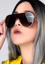 Dime Optics Tarzana Polarized Sunglasses in gold brown — model side view