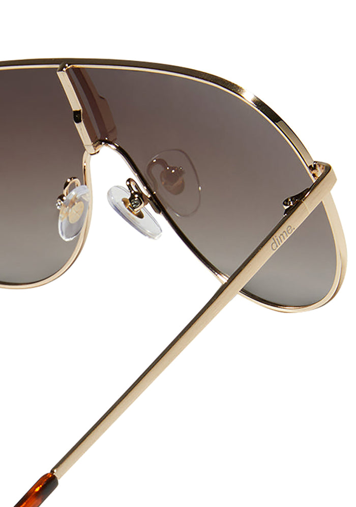 Dime Optics Tarzana Polarized Sunglasses in gold brown — back view