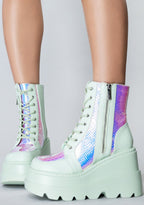 Front view of the exclusive RADIO Prismatic Sage platform boots on-model, showcasing the mint green laces, secure metal eyelets, and lightweight chunky combat boot silhouette.