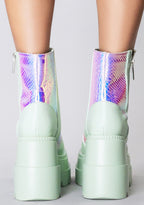 Rear view of the Prismatic Sage platform boots on-model, detailing the high-top ankle fit, clean back panel stitching, and the stacked 3-inch block heel.