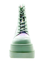 Studio front profile of the Cape Robbin X LASR exclusive sage green boots, emphasizing the wide textured toe cap, crisp matching laces, and rugged platform tread.