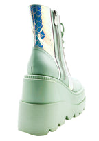 Close-up view of the inner side of the mint green RADIO platform boot, highlighting the convenient side metal zipper closure and the sleek, contoured fit of the sole.