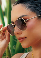 Dime Optics X Les Do Makeup After Party Polarized Sunglasses in gold brown gradient — model view