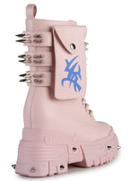 Close-up studio view of Anthony Wang X WTF CV Chem Baby Metal Pink platform boot detailing the functional calf pocket, silver hardware rivets, and defensive spikes along the lower armor panel